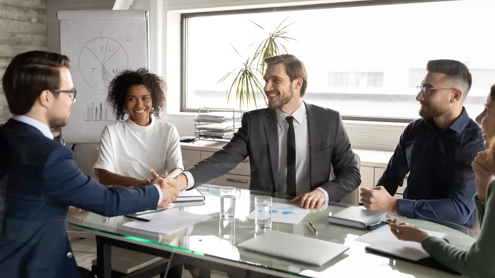 Shaking hands during a meeting